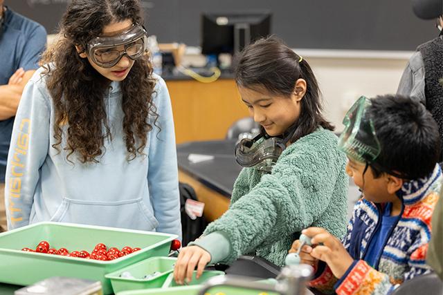 Kids doing science experiment during Free College Week.